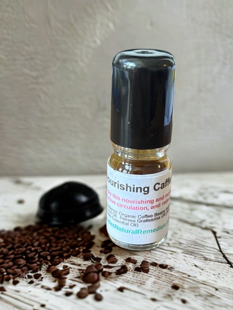 A 5ml glass rollerball bottle of Wake Up Eyes Caffeine Eye Roller, featuring a stainless steel applicator and coffee-infused botanical oils.