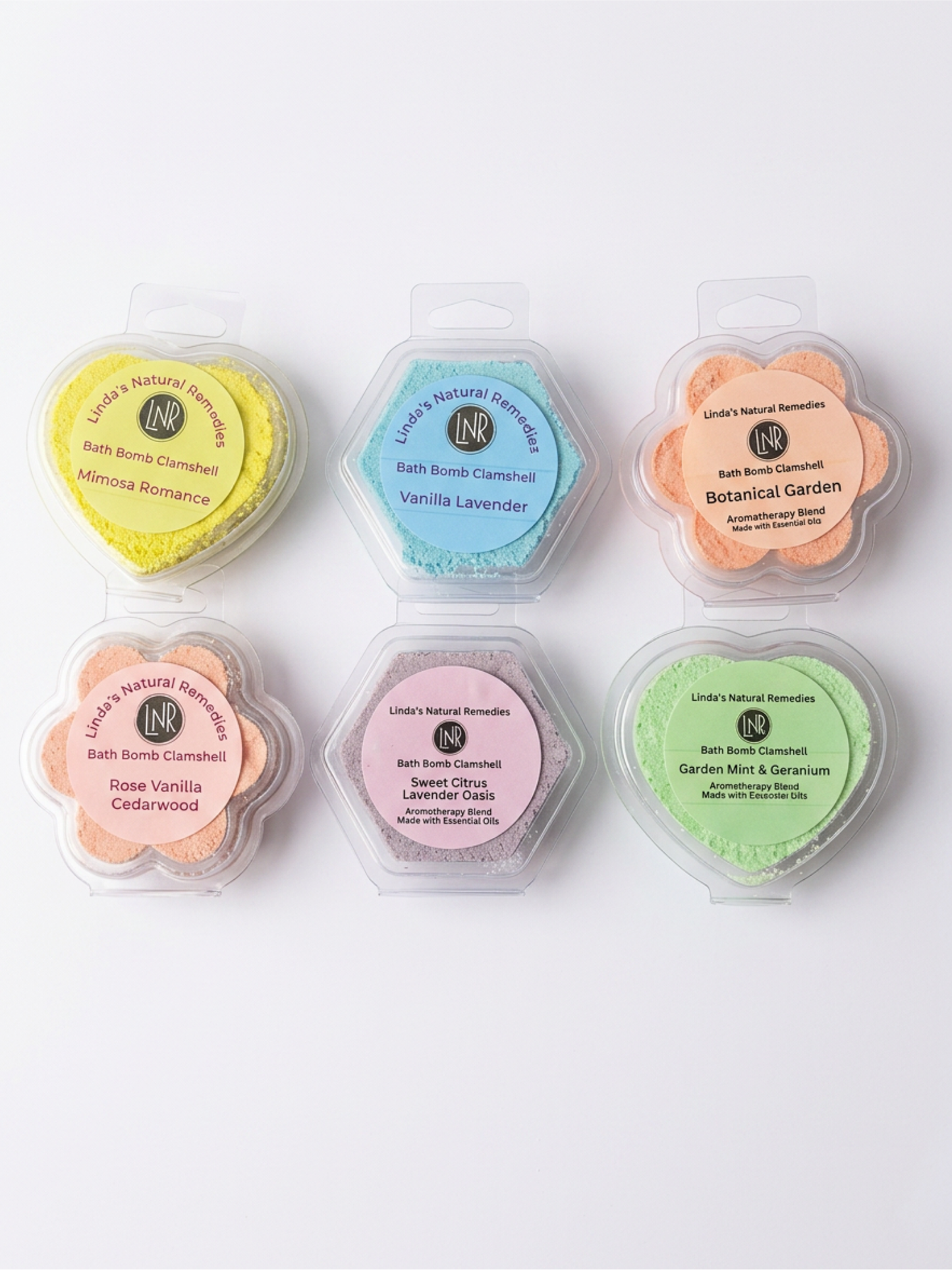 Set of six bath bomb containers with colorful lids on a white background