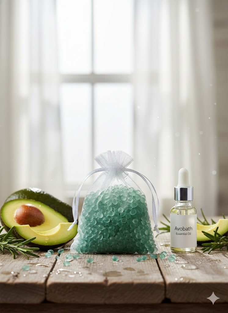 Deep green mica aroma beads in a white organza bag, shown with fresh avocado slices and rosemary sprigs to highlight the clean fragrance.