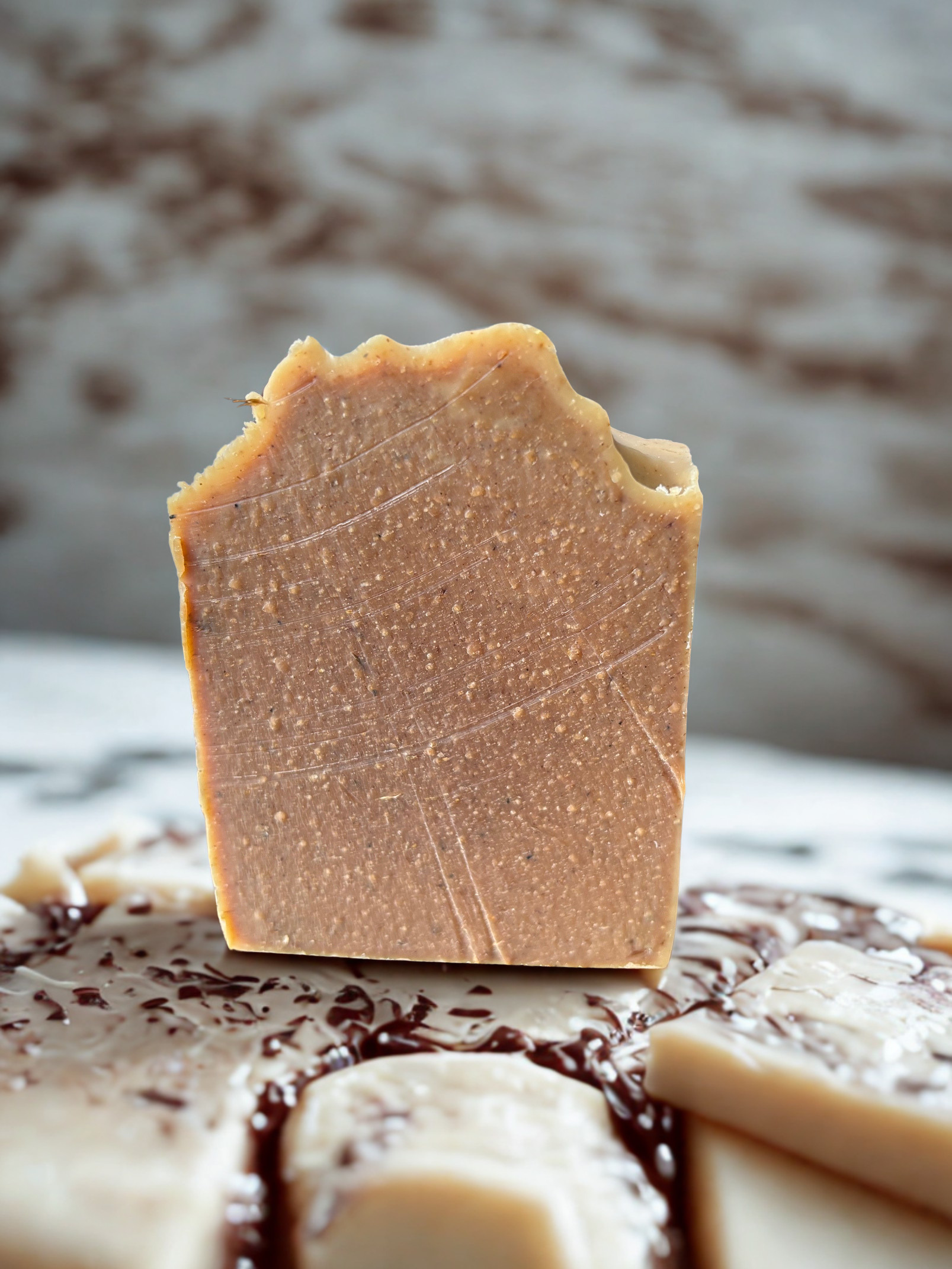 Bar of soap with a textured surface on a marble surface