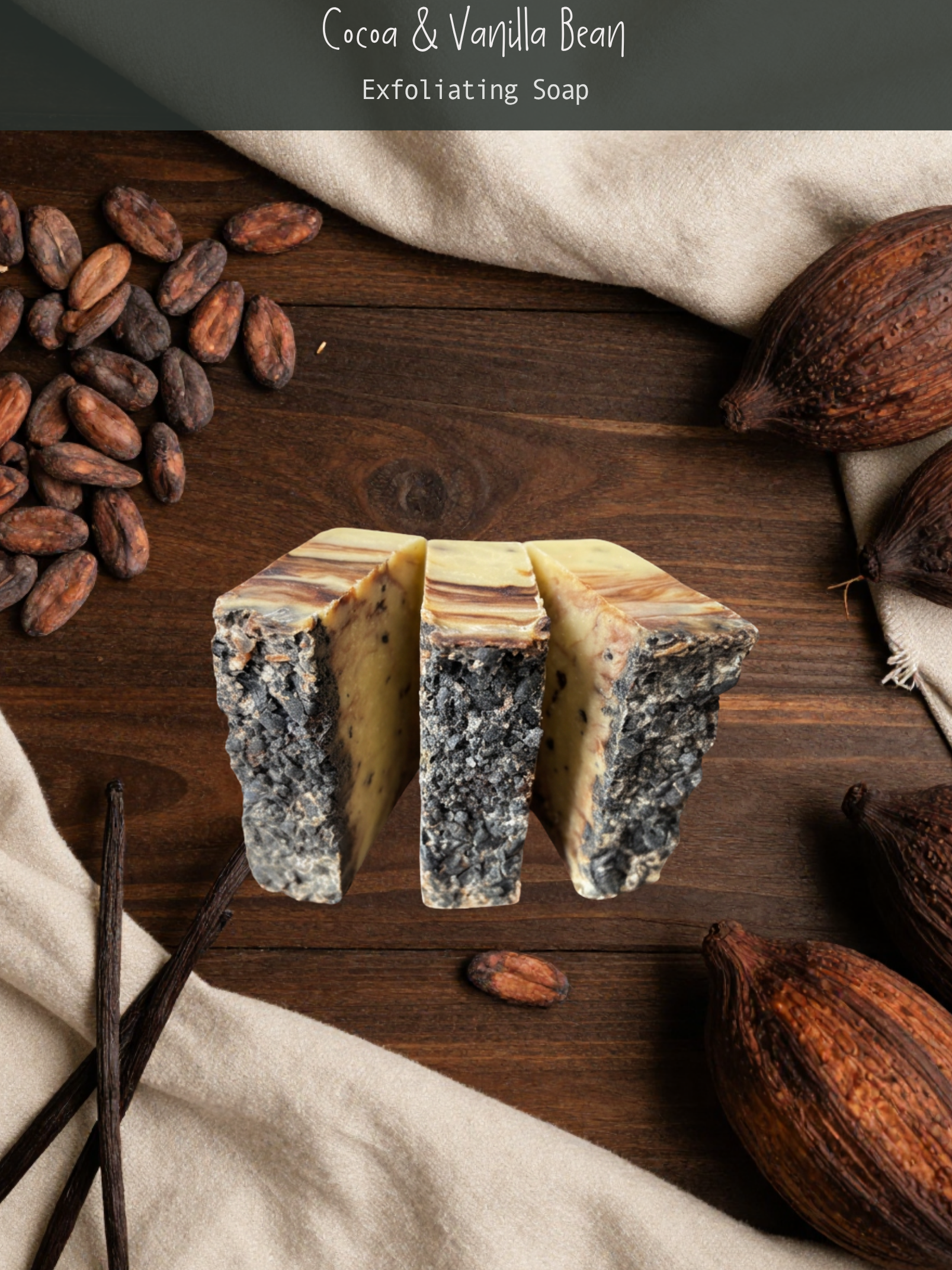 Cocoa and vanilla bean exfoliating soap on a wooden surface with cacao beans and a vanilla pod.