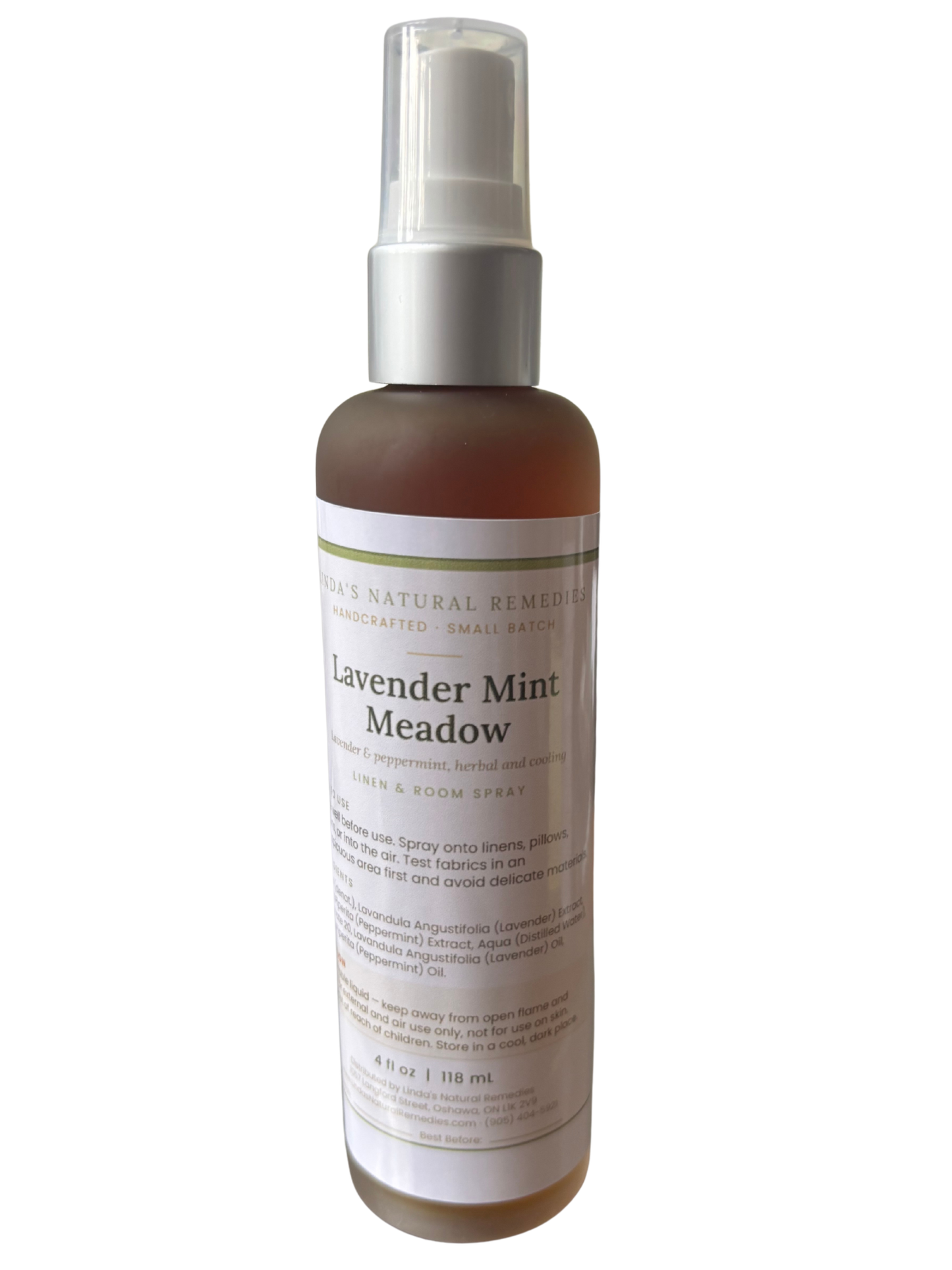 Lavender Mint Meadow natural room spray in a clear glass bottle with spray nozzle, white backdrop