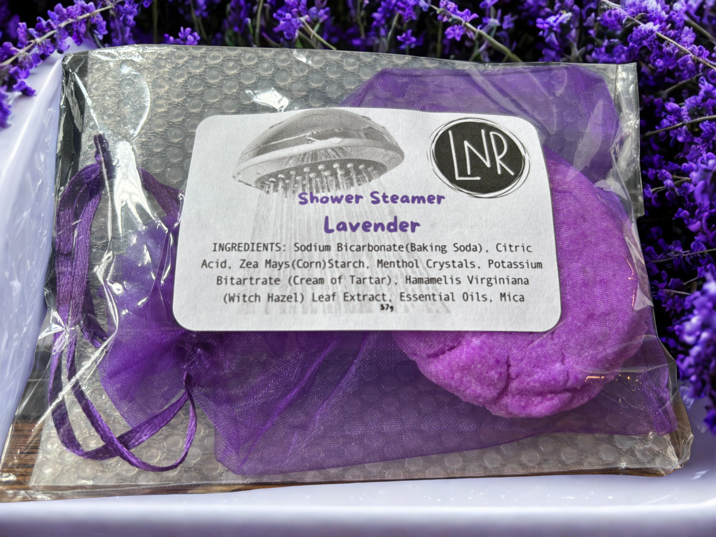 Purple menthol shower steamer with lavender essential oil for relaxation.