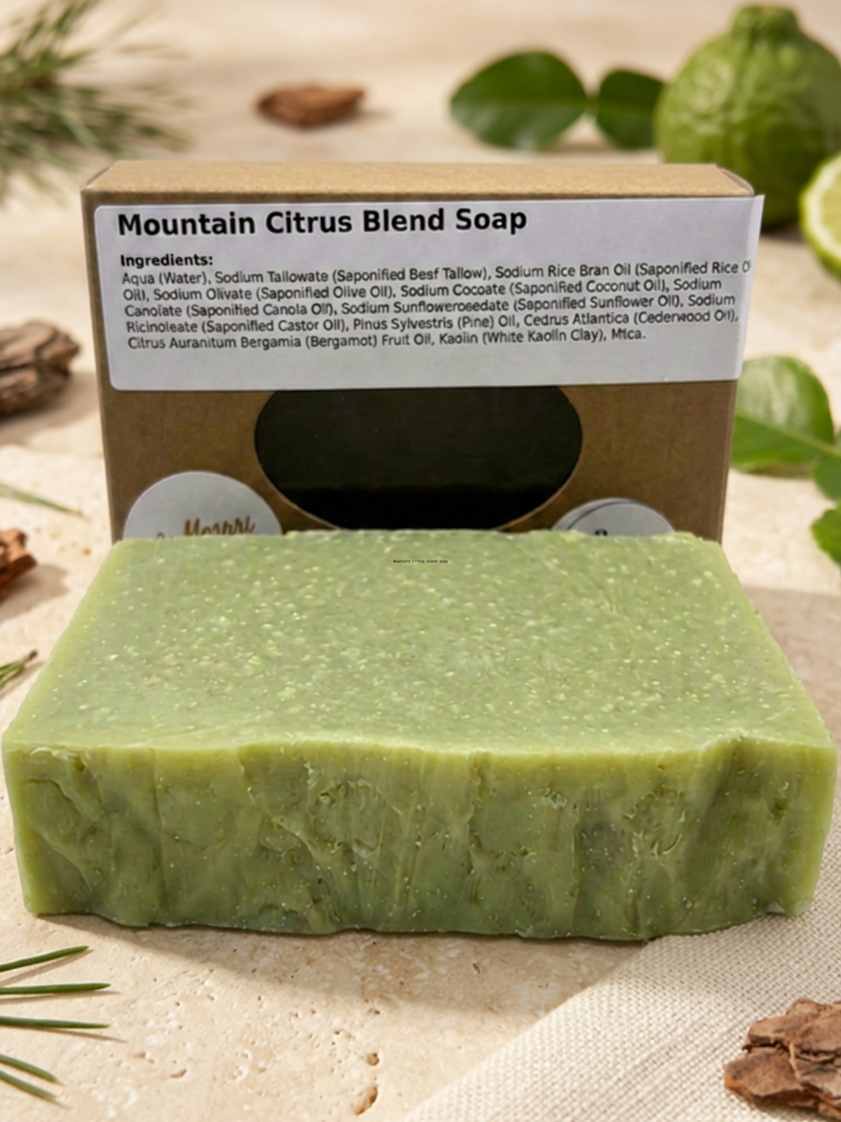 Mountain Citrus Blend soap bar resting among fresh botanical leaves and citrus slices, highlighting its natural ingredients.