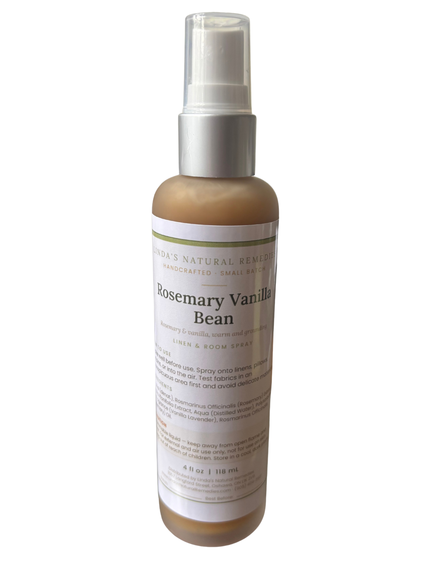 Glass cello spray bottle of Rosemary Vanilla Bean room spray with label, photographed on a plain white background