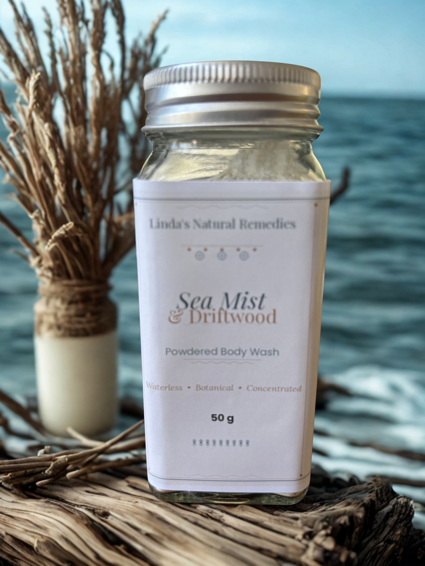 Powdered body wash container labeled 'Sea Mist & Driftwood' by Linda's Natural Remedies with a natural background.