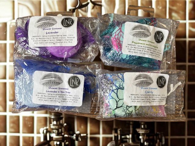 Breathe Easy Menthol Shower Steamers by Linda's Natural Remedies, available in Lavender, Tea Tree, Peppermint, and Eucalyptus scents for an aromatherapy spa experience.