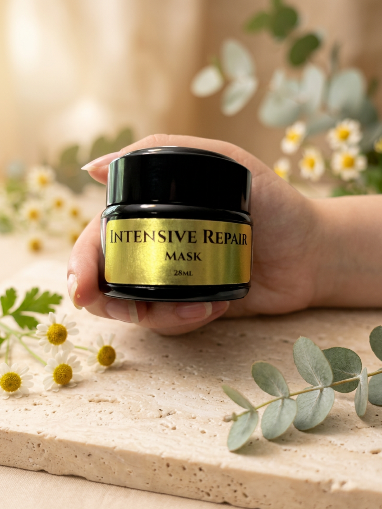 Hand holding an 'Intensive Repair Mask' jar with a natural background