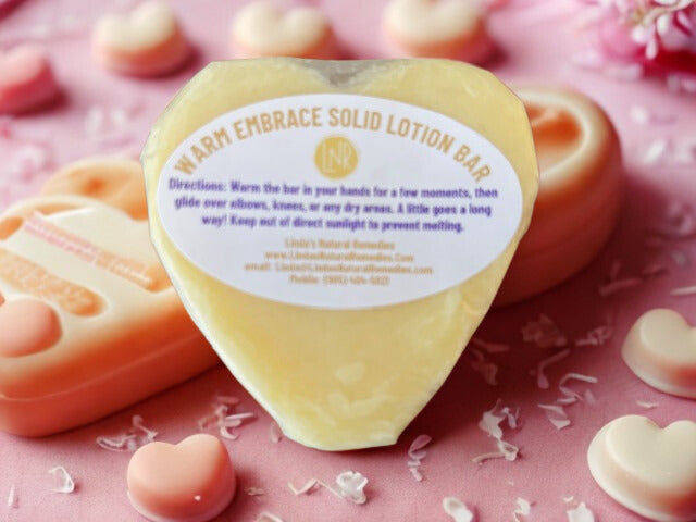 Eco-friendly hand-wrapped Luxe Heart Lotion Bar in Warm Embrace scent. Packaged in artisan wax paper with a custom label by Linda's Natural Remedies, Oshawa.